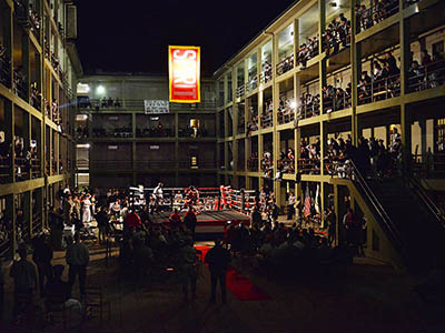 Members of VMI’s club boxing team trade blows Nov. 11 in a ring set up in New Barracks Courtyard surrounded by cadets cheering from the courtyard and the stoops. – VMI Photo by Stephen Hanes.