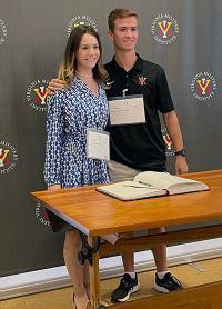 Lucy and Tyler Hagan congratulate each other after signing the Matriculation Book and becoming VMI rats. -VMI Photo by Marianne Hause.