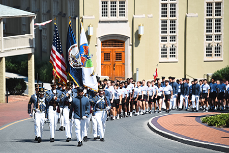 RCO Mark Shelton II '24 leads the Rat Mass to barrack to begin their journey at VMI.