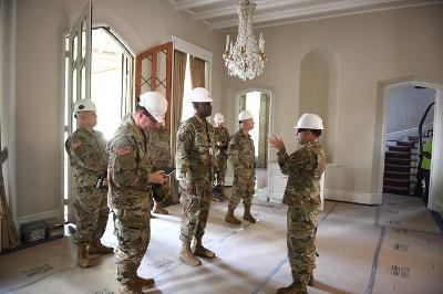 Maj. Gen. Wins touring the residence pre-construction
