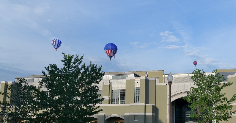 Hot air balloons fly over Marshall Hall during the summer.