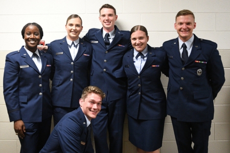 Air Force ROTC cadets pose before their commissioning ceremony where they will become Second Lieutenants in the U.S. Air Force or U.S. Space Force.