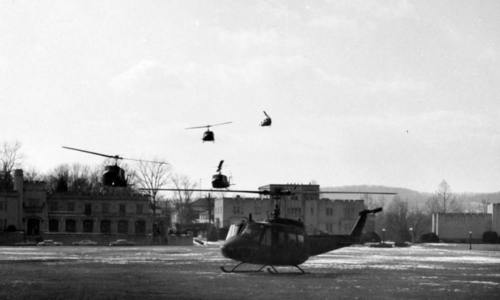 Helicopters land on the VMI Parade Ground to take Army ROTC cadets to Fort Pickett during FTX Feb. 13, 1982.