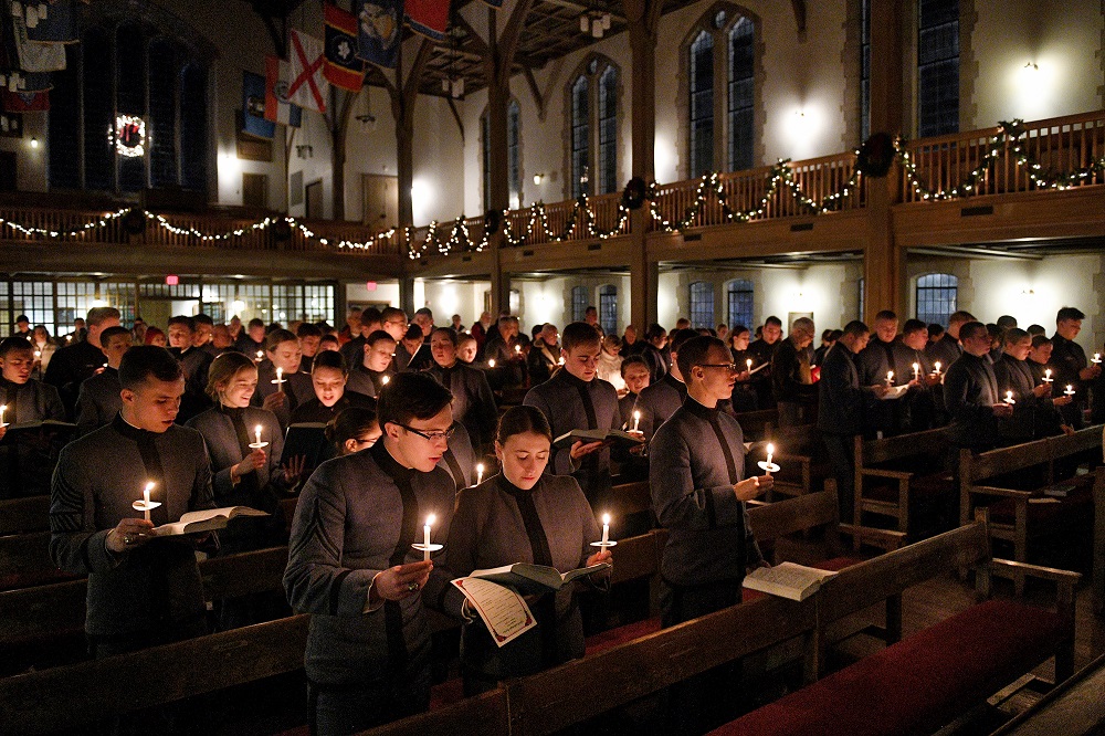 Cadets, students at VMI, gather in Memorial Hall for a candlelight service near the holidays.