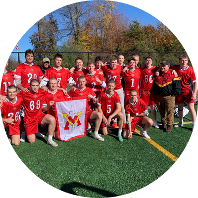 VMI Club Lacrosse team poses with coaching staff and a VMI flag.