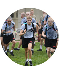 VMI cadets running across field during first year physical exercises