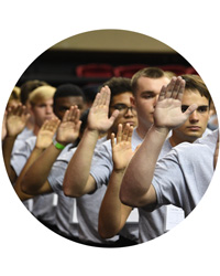 VMI new cadets raise their hands while taking oath on Matriculation Day