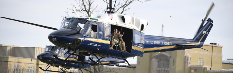 VMI cadets in Air Force ROTC on an Air Force helicopter flying over post, VMI's word for campus.