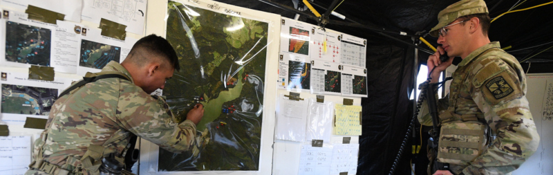 Army ROTC cadets during field training exercises at a military college working with communications