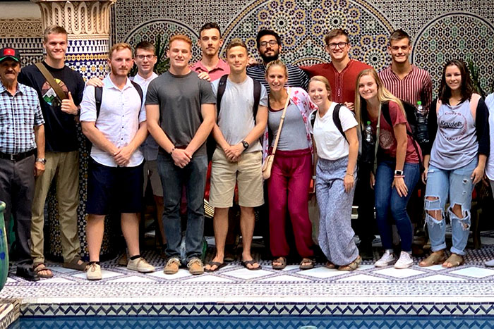 A group of VMI students are shown in a group photo in Morocco