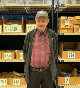 Terry McGowan, standing in the Military Store.