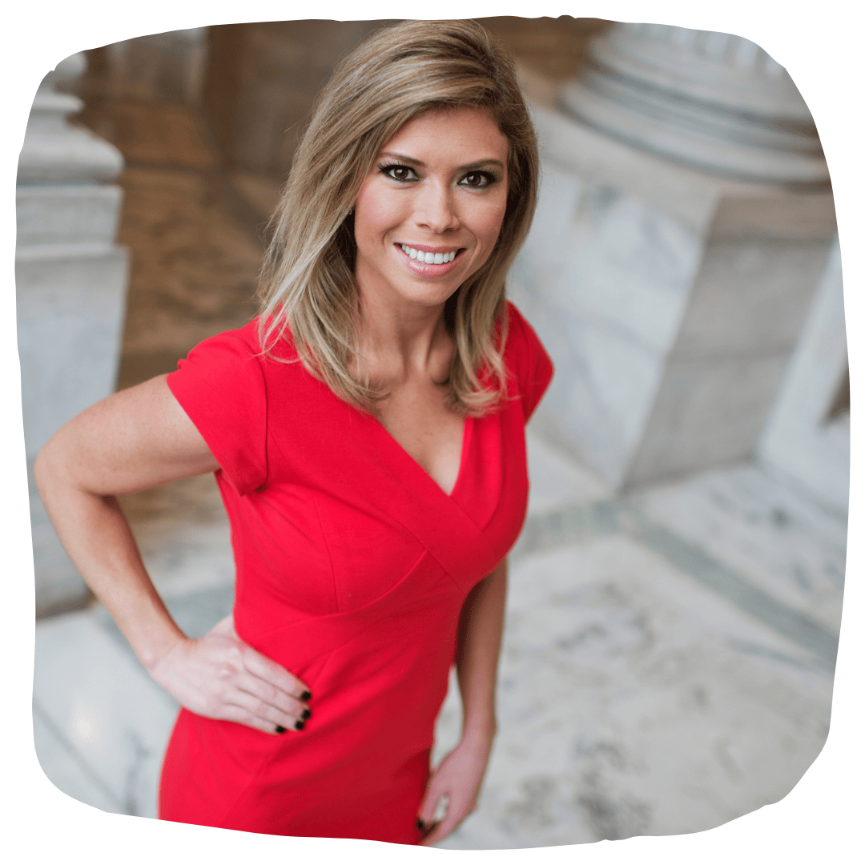 Amber Smith caucasian woman with dark blonde hair in red v-neck cap sleeved dress