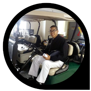 Photo of Binh Tran '23  in golf cart