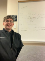 Jude Roberts, VMI Class of 2025, poses in a classroom during his research.