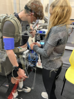 Cadets Lasalle and McGovern check equipment before their testing on load carriage's effects on oxygen.