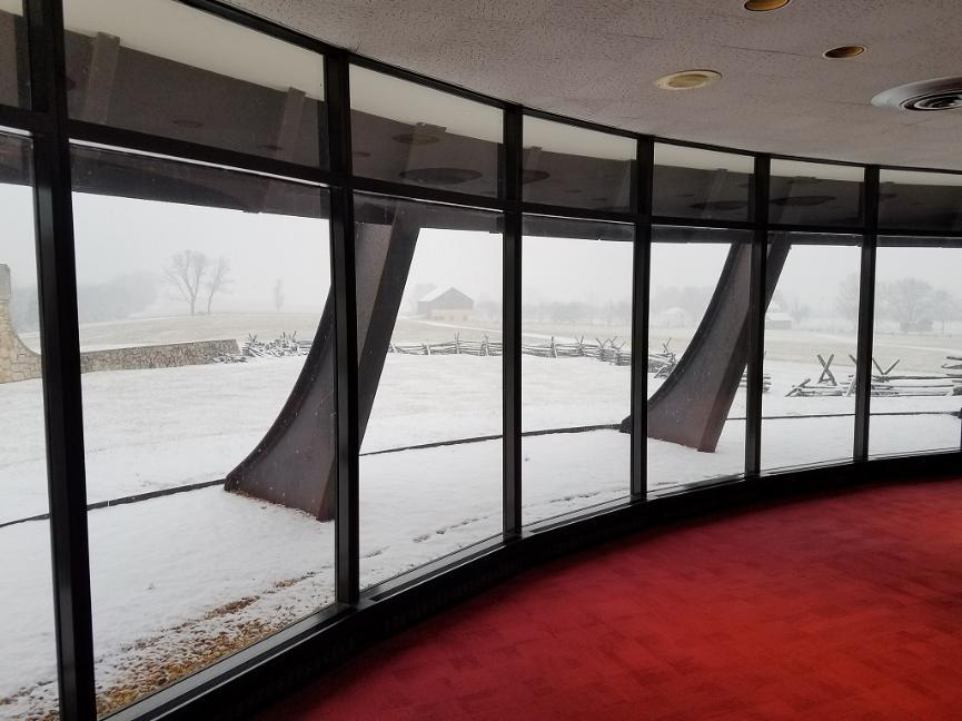 Photograph of view from inside the museum viewing the battlefield in winter.