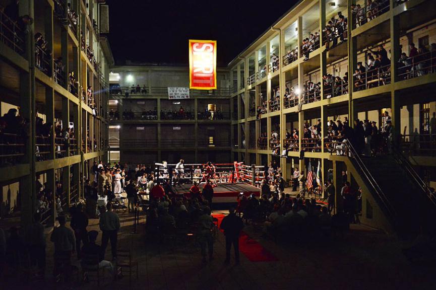 Members of VMI’s club boxing team trade blows Nov. 11 in a ring set up in New Barracks Courtyard surrounded by cadets cheering from the courtyard and the stoops. – VMI Photo by Stephen Hanes.