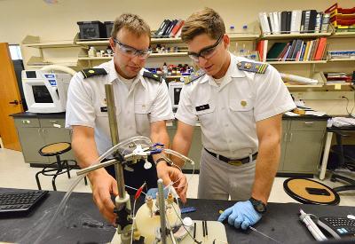 A professor and cadet work in the chemistry lab.
