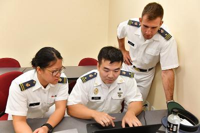 Mu-Chi Lu ’19, Hanchu Zhang ’19, and Edward Olbrych ’18 chose between two prompts to solve mathematically during a 23-hour competition hosted by VMI Sept. 30 through Oct. 1.