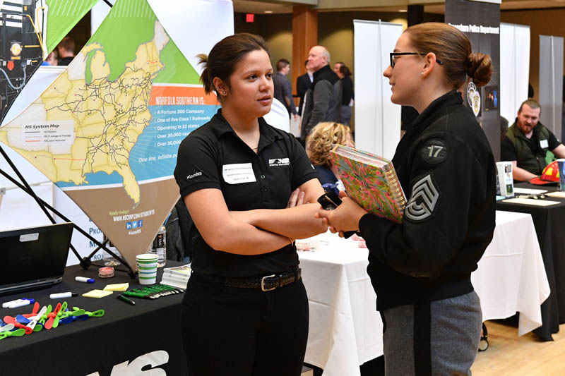 Sarah Hoover ’13, representing Norfolk Southern Corporation at the career fair, speaks with Allison Partin ‘17. – VMI Photos by Kelly Nye.  