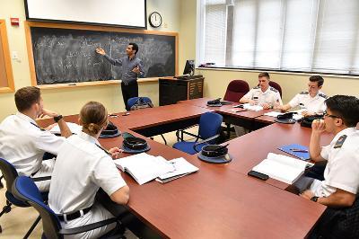 Cadets look on as their professor teaches Arabic.