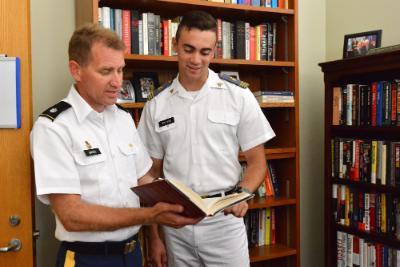 Jacob Van Dyke ’19 confers with Lt. Col. Spencer Bakich about his thesis for the national security minor.—VMI Photo by Mary Price.
