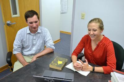 Maj. Steven Knepper and Krystal Graves discuss her summer research project on the Iliad.—VMI Photo by Mary Price.