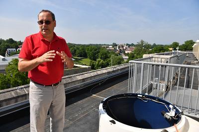 Col. Greg Topasna shows off the new solar telescope dome installed atop Maury-Brooke Hall.