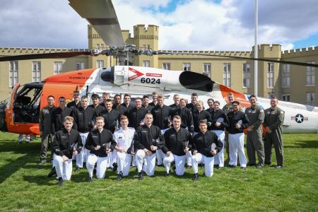 Coast Guard Detachment in front of U.S. Coast Guard HH-60 helicopter
