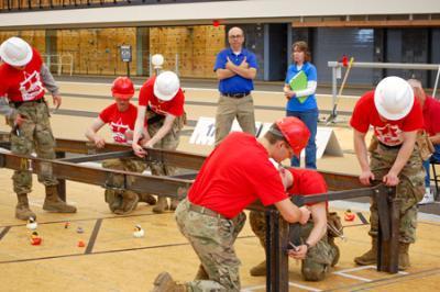 VMI Cadets construct a steel bridge under a time limit in the Corps Physical Training Facility.—VMI Photos by Col. Charles “Chuck” Newhouse