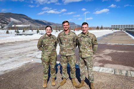 Kirsten Engel ’22, Glen Lash ’22, and Ryan Carpino ’23 at the U.S. Air Force Academy with backdrop of mountains