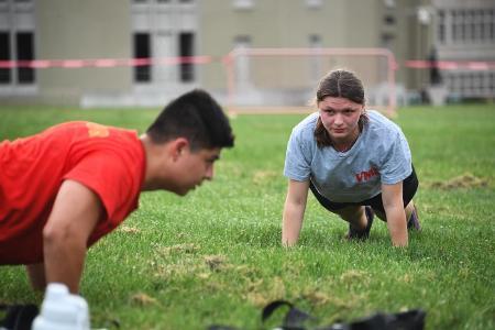 A VMI cadet lead a group of appointed students in physical training during the Summer Transition Program (STP).