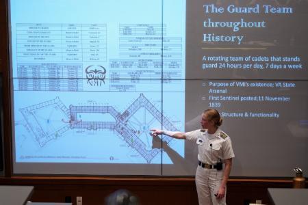 Honors student Annie Townsend '24 presents her senior thesis on the security and history of barracks.