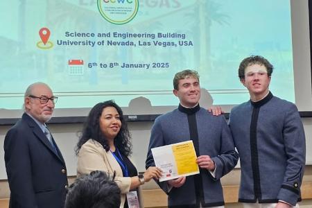 Michael Jorgensen ’27 and Sean Harvey ’27 receive their award at the 15th Annual IEEE Computing and Communication Workshop and Conference at the University of Nevada, Las Vegas.