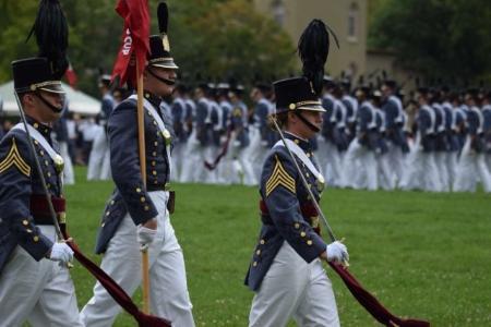 Cadet Janine Colantonio, VMI class of 2023, Delta Company Commander, leads her company across the VMI parade field for pass and review.