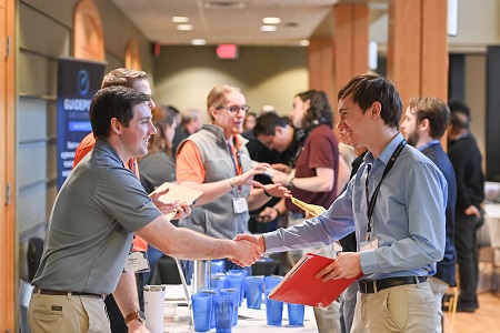 Cyber Cup participants check in and gather materials.