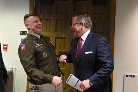 Maj. Gen. James “Pat” Work and John Adams ’96, BOV president, share a laugh before the ceremony in Memorial Hall.