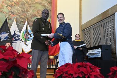 Luke Mayr ’24, an economics and business major from Fairfield, receives his diploma from Maj. Gen. Cedric T. Wins ’85. –VMI Photo by Kelly Nye.