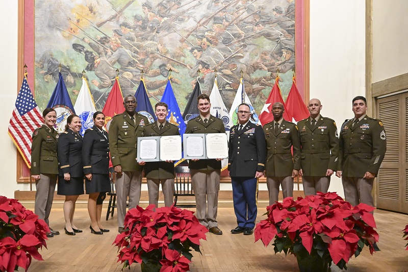 Jarrett Taylor Herndon ’24 and Joseph Matthew Slezak ’24 pose with Institute and Army ROTC leaders during the commissioning ceremony.