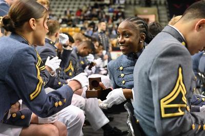 Two students at VMI, called cadets, admire their new class rings in Cameron Hall, a milestone at this historic military college in Virginia.