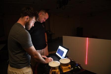 Bruce Hay ’25 and Maj. Craig Altmann work with the off-road laser measurement mapping system. –VMI Photo by Kelly Nye.