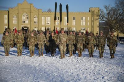 VMI regimental commander, Brian Pritchard ’25, leads the Corps down the snow-covered Parade Ground.