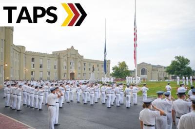 Cadets saluting at flags with word TAPS