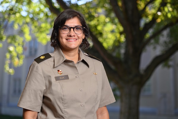 Admissions staff member Domonique Blum smiling outside office building