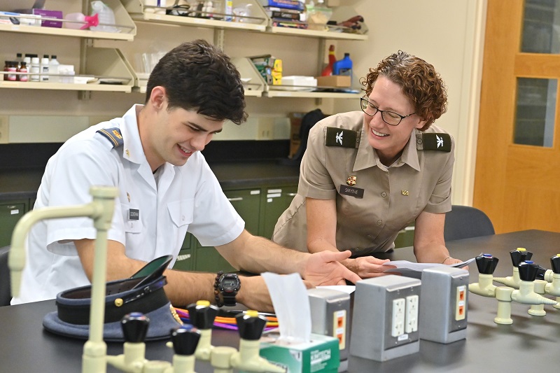 A student (cadet) at VMI, a military college in Virginia, works with a biology professor for one-on-one instruction during a hands-on lesson.