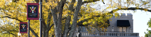 View of Moody Hall at VMI with trees in the foreground.