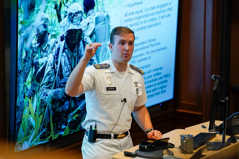 A senior at VMI presents his thesis undergraduate research at VMI, a military college during Honors Week activities.