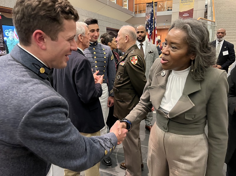 A student (cadet) at VMI meets with Commonwealth leaders at the Virginia Legislative Reception, promoting the importance of a VMI education.