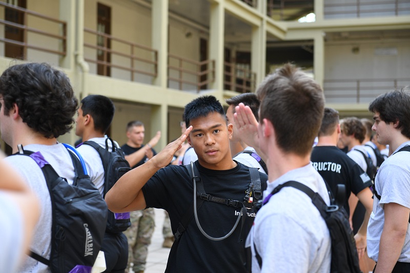 Upperclass cadet leader, a member of Cadre, instructs VMI freshman, known as rats, in proper salute technique during Matriculation Week.