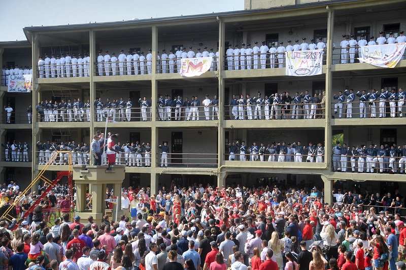 VMI alumni gather in barracks for an Old Yell.